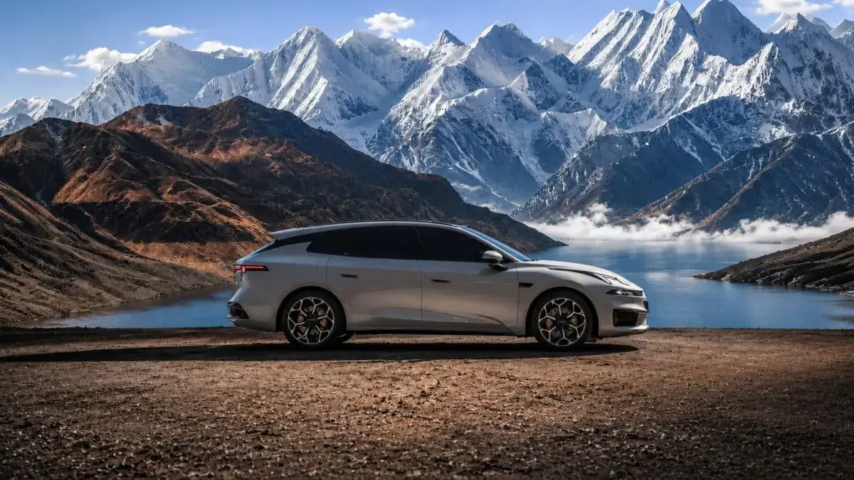 Lynk & Co 07 GT beside mountain scenery